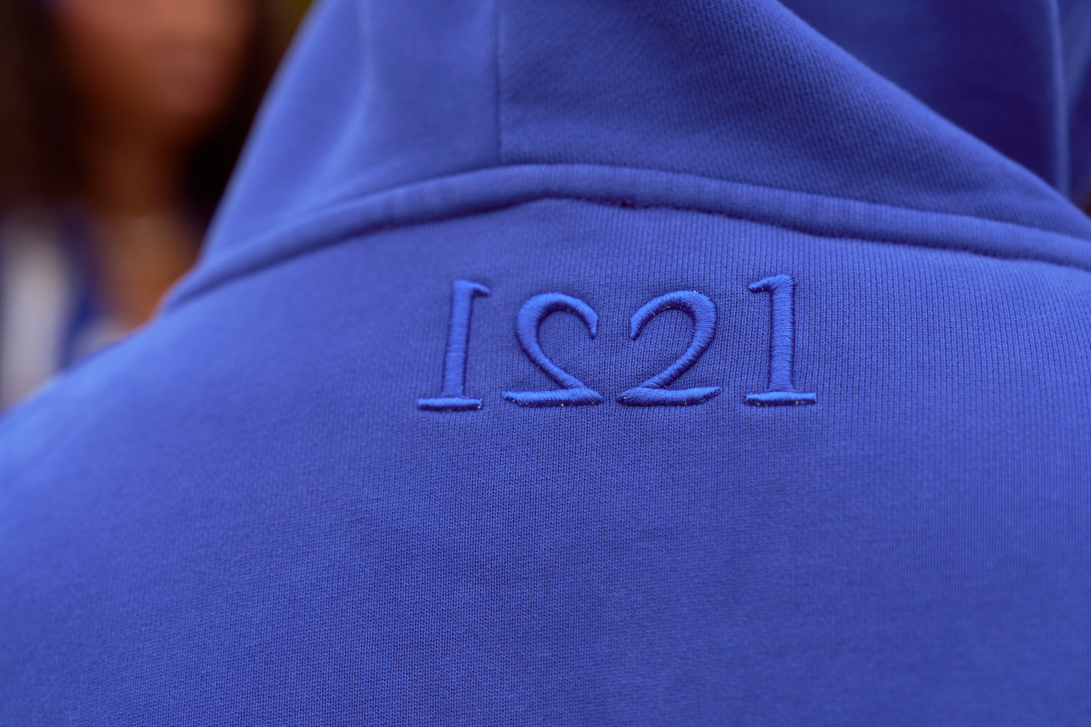 Male wearing blue hoodie